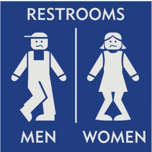 blue restroom sign with engraved european style figures of boy and girl