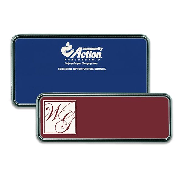 Blue and red plastic name tags with silver frames and engraved logos.