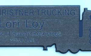 custom shaped engraved name tag in semi-truck shape with engraved text