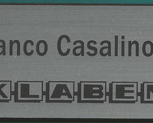 silver engraved name tag with logo and name