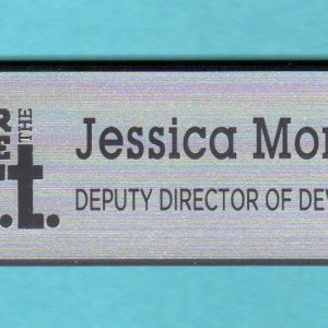 silver name tag with black engraved logo and text