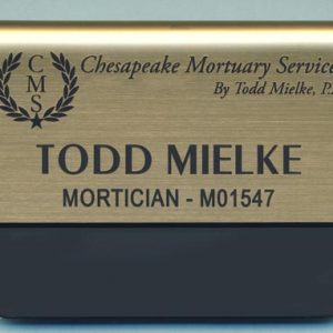 gold metallic pocket name tag with engraved logo and text