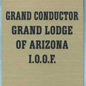 oversized gold pocket tag with engraved text