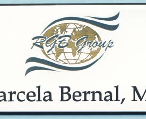 Full color name tag with gold metallic logo and engraved name