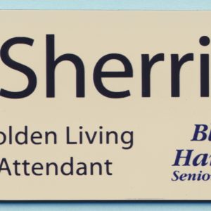 Cream colored name tag with full color printed logo and text