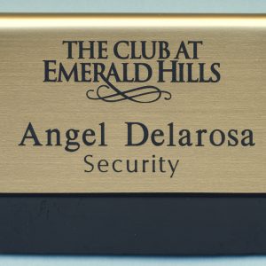gold metallic pocket name tag with black engraved logo and text