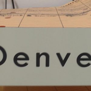 engraved name plate with 2 drilled holes & rings for hanging