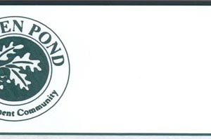 white name tag with pine green engraved logo and text