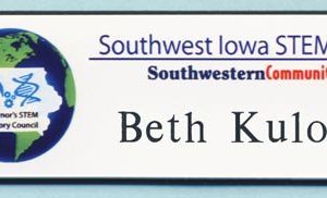 white full color name tag with printed logo and black engraved name