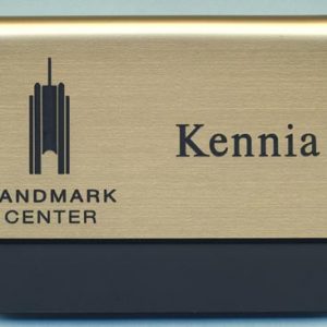 metallic gold pocket name tag with black engraved logo and text