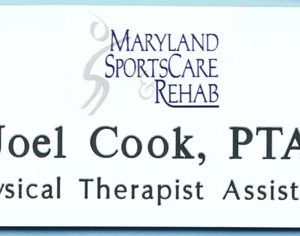 white name tag with full color printed logo and black engraved text