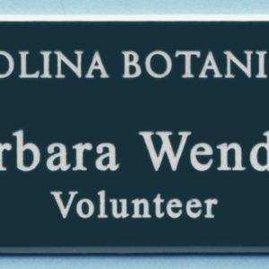 pine green name tag with white engraved logo and text