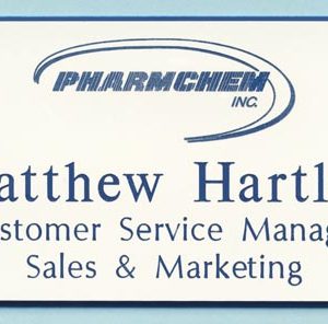 white name tag with blue engraved logo and text