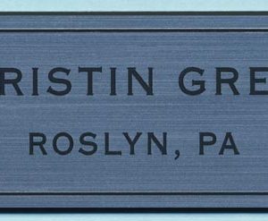 metallic silver name tag with black engraves text