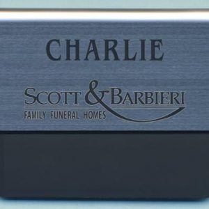 silver metallic pocket tag with blck engraved logo and text