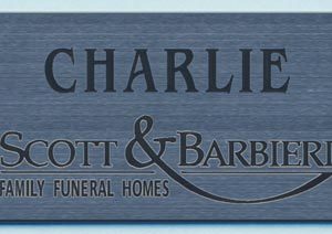 silver metallic anme tag with black engraved logo and text
