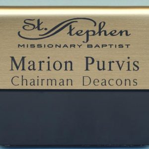 gold metallic pocket name tag with black engraved logo and name