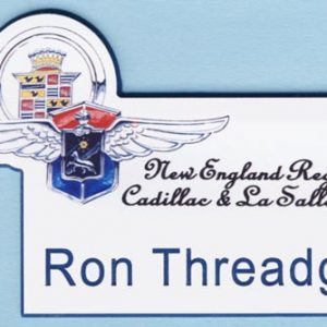 White full color, custom shaped name tag with printed logo and blue engraved text