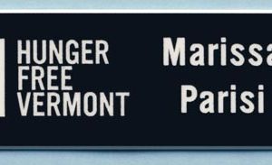 Black name tag with white engraved logo and 1 line of text