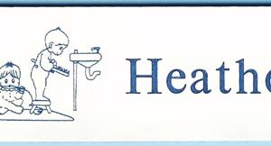 White name tag with blue engraved logo and text