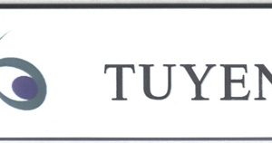 White name tag with full color logo and black engraved name