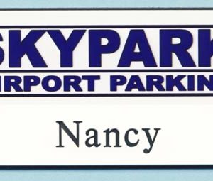 White full color name tag with printed logo and engraved names