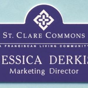 purple custom shaped name tag with engraved white logo & text