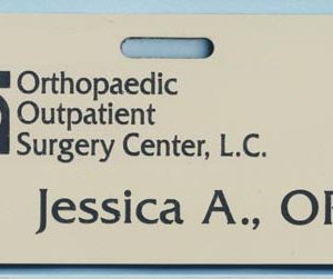 Almond name tag with black engraved logo and text
