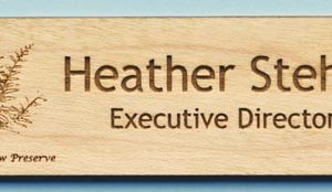 Wooden tag with laser engraved logo and text