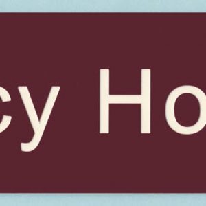 Burgundy name plate with engraved white logo and text