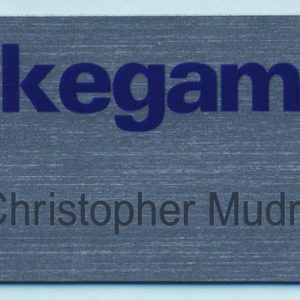 Full color silver name tag with printed logo and black engraved text