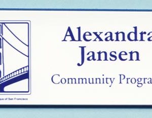 White name tag with blue printed logo and text