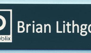 Engraved pinegreen name tag with white logo and text