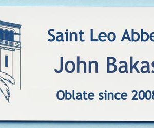 Engraved white tag with blue engrave logo and text