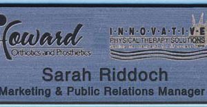 Laser engraved silver/black name tag with logo and text