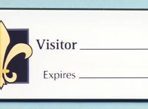 White full color name tag with visitor info, printed logo and text