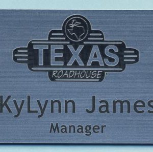 Engraved silver tag with lasered logo and engraved text
