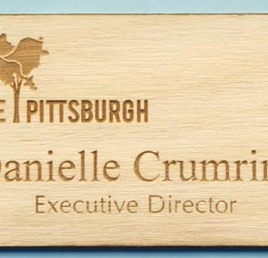 Wooden name tag with laser engraved logo