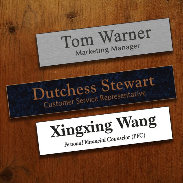 Plastic name plates engraved with 2 lines of text