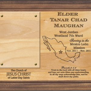 laser engraved lds missionary plaque on solid alder wood with dark accents at top & bottom, featuring missionary's name, dates of service, mission boundaries, favorite scripture passage, and a clear window for inserting a 3.5" x 2" photo