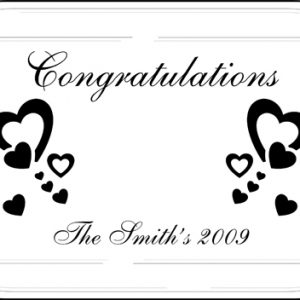 Laser engraved 9 x 13 casserole dish / glass baking dish with the word "Congratulations", heart graphics, & 1 line of customized text engraved on the underside of the dish