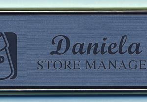 Egraved framed name tag with up to 2 lines of text