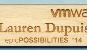 Laser engraved name tag with 2 logos and 1 line of text
