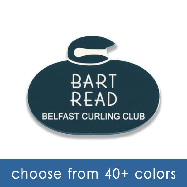 green curling club name tag shaped like curling stone with white engraved text