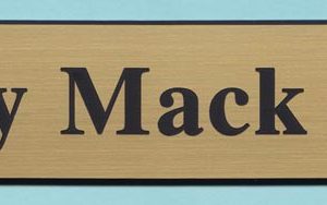 Engraved plate with name and logo