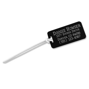 Engraved personalized luggage tag with multiple lines of text.