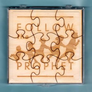 Laser-engraved birch wood LDS primary puzzle featuring the words "Follow The Prophet" & graphics
