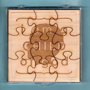 Laser-engraved birch wood LDS primary puzzle featuring the words "I Am A Child Of God" & graphics