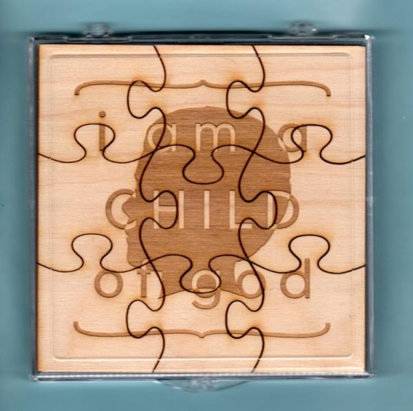 Laser-engraved birch wood LDS primary puzzle featuring the words "I Am A Child Of God" & graphics