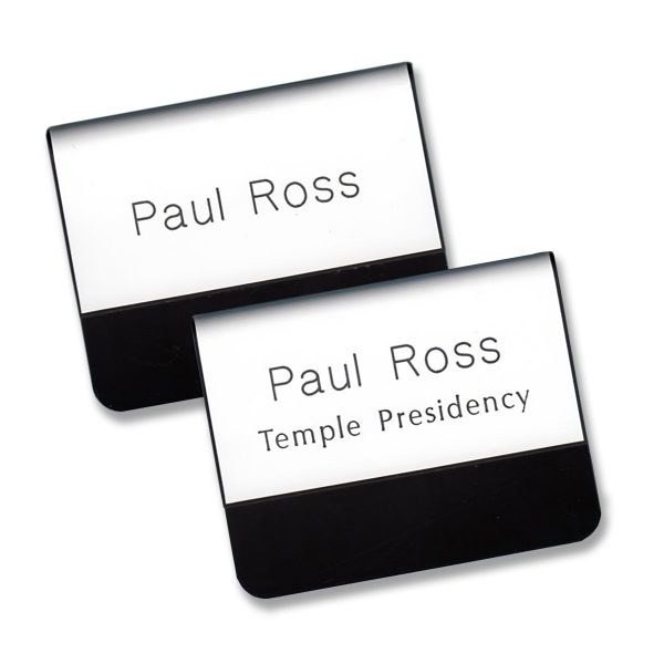 Engraved white temple pocket name tags with names and titles.